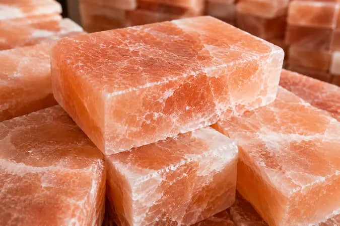 Close-up texture of authentic Himalayan salt bricks showing natural crystal pattern